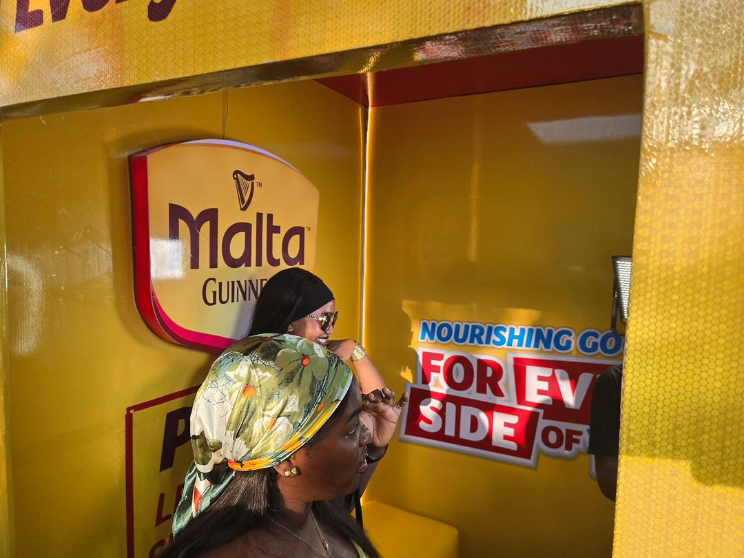 Malta Guinness photobooth — interior with branded signage and guests